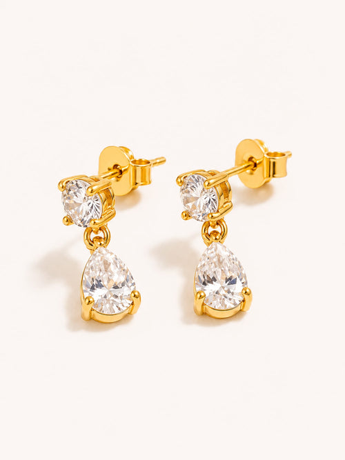 Gold drop stud earrings featuring round and pear-cut clear cubic zirconia stones in premium stainless steel.