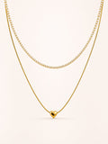Layered heart necklace featuring a polished heart pendant and sparkling white CZ tennis chain in 18K gold plated stainless steel.