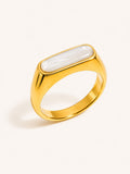 Mother of pearl signet ring with a polished gold finish and minimalist rectangular design.