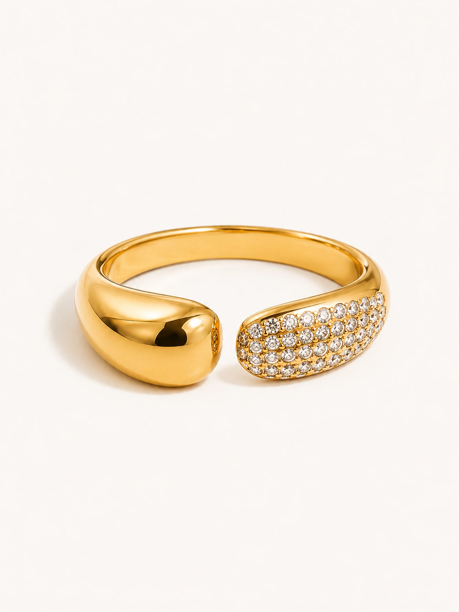 Pavé open wrap ring featuring white cubic zirconia stones in a polished gold finish.