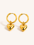 Gold puffy heart hoop earrings crafted in stainless steel with polished heart charm design.