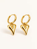 Puffy heart huggie earrings in polished gold with a modern minimalist drop design.