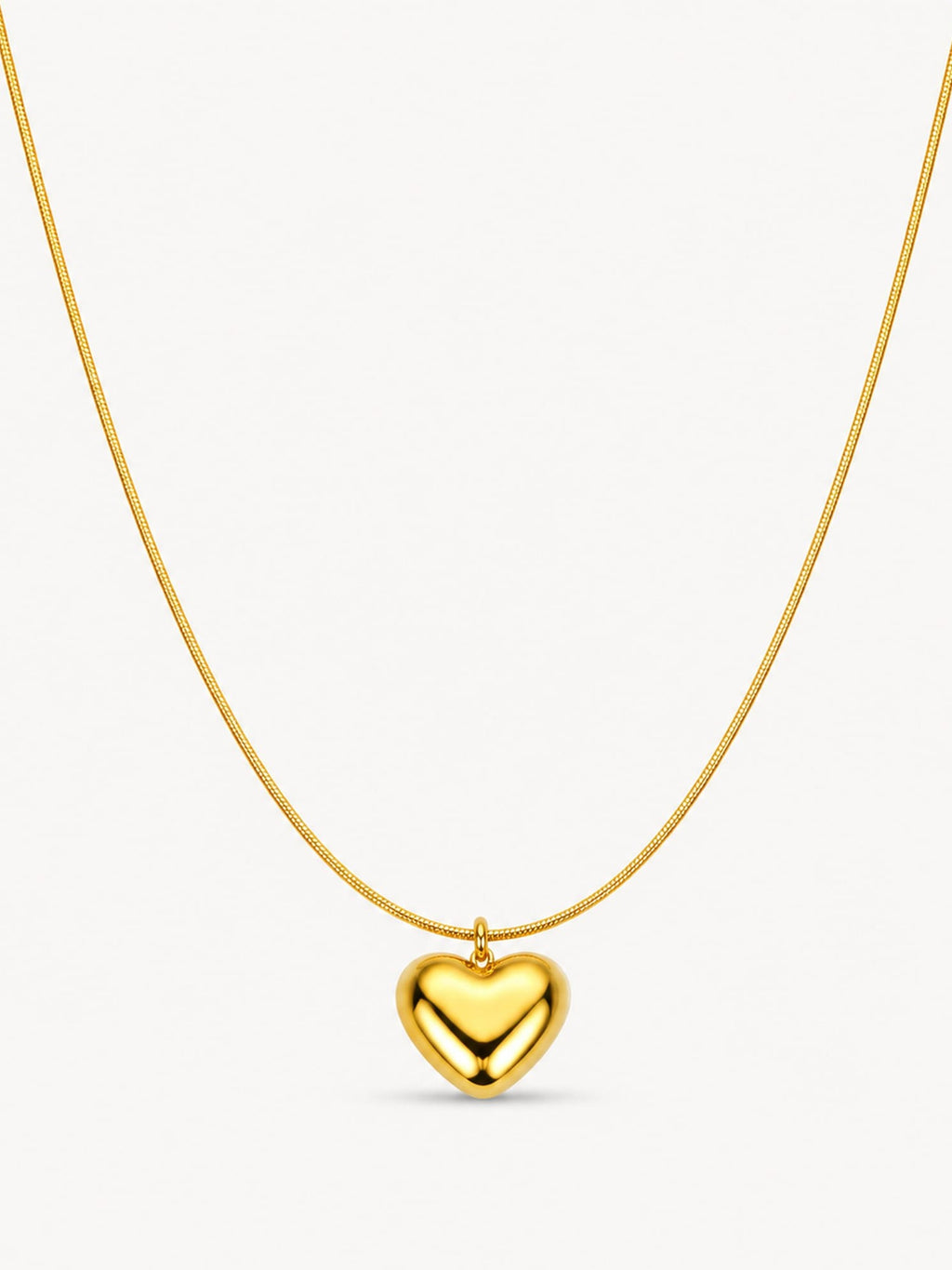 Puffy heart pendant necklace in 18K gold plated stainless steel featuring a polished heart charm on a sleek snake chain.